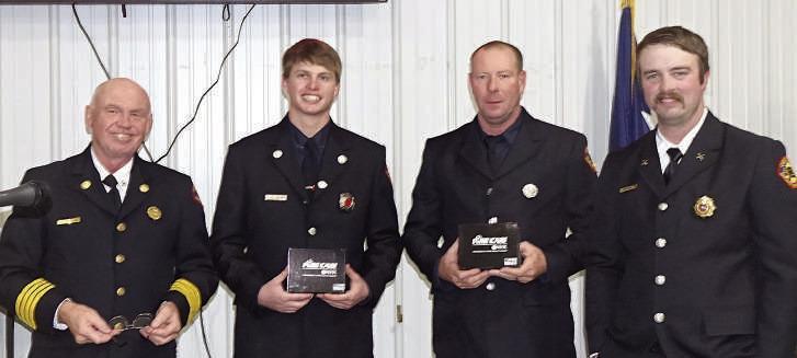 Cass County ESD 2 Fire Chief Eric White, left, and Assistant Chief David Jackson, right, are awarding Connor Alexander and Chris Hill helmet mounted cameras. Cass County ESD 2 Fire Chief Eric White, left, and Assistant Chief David Jackson, right, are awarding Connor Alexander and Chris Hill helmet mounted cameras.