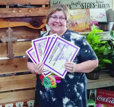 Jo Anna Duncan, owner of Olde 1852 Market Company in Linden, stands with the many certificates her business and that of Barbwyre Boutique won during the Reader’s Choice Awards presented by the Journal-Sun. Her shop was voted Best Gift Shop. Barbwyre Bou A winning smile