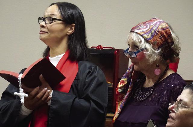 Probably the wildest character in the “Murder at the Christmas Feast” is the preacher at left, Brittany Surratt. Her flower child friend is Gail Small. Probably the wildest character in the “Murder at the Christmas Feast” is the preacher at left, Brittany Surratt. Her flower child friend is Gail Small.
