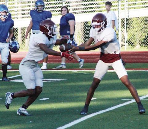 Rabbit QB Peyton Harrison hands the ball off to running back Markeylin Batton during Atlanta’s scrimmage with Hooks. (Photos by Samantha Wilbanks) It’s the most wonderful time of the year