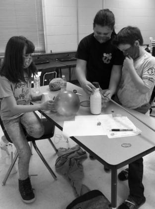 Students in Gifted and Talented at Morris Upchurch Middle School worked through the Engineering Design Process to help solve a couple of real life problems. Photos by Phyllis Warren M.U.M.S. students solve agricultural problems