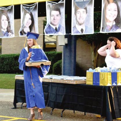 Bloomburg graduates not only obtained their diplomas, but each received a new laptop with a carrying case and accessories. These gifts were a collective effort on the part of Superintendent Brian Stroman and the Bloomburg ISD School Board and Administrati Article Image Alt Text