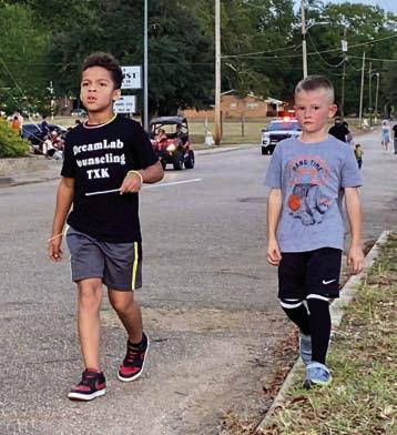 2nd and 1st place Monster Mile winners show good sportsmanship as they take a beat around the block together to cool down after the race. Hiram haunted by glowing goblins, ghouls