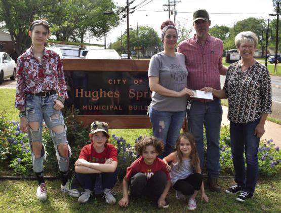 The Doughty family, including parents Derek and Rena, and their children: Daryl, Dallas, Dylan, and Danica, accepts the grand prize of $500 for the Cash for Trash contest from organizer Jolene Turner.The Doughty’s picked up 1120 bags and items over the Hughes Springs ‘Cash for Trash’ deemed a success