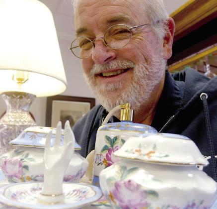 Downtown store owner Ted Brabham doesn’t need much to put on his engaging face. In fact, he’s an antique shop owner and so knows quality when he sees it. Old time quality makes him smile. Faces