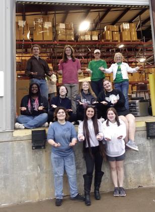 Atlanta High School volunteers and two members of the Amity Study Club hold out their arms to receive electronic recycle materials.They are, first row from left,Amelia Kassens, McKenzie Lampshire and Brooklyn Sulllivan. Second row,Aaliyah Smith, Madison B Electronics Recycling