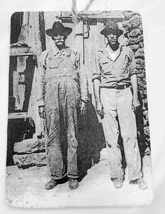 J.W. Foshee (left) and son George, early roots of the Surratt family legacy. Courtesy of Rhonda Surratt J.W. Foshee (left) and son George, early roots of the Surratt family legacy. Courtesy of Rhonda Surratt