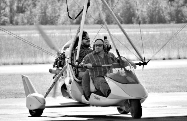 Heinrich Theron takes Casey Sullivan for a flight on his ultralight trike. Atlanta Airport hosts Fall Fly-In