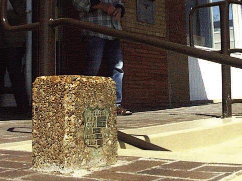 This stone column with its federal shields protruding through the side walk in front of Linden City Hall indicates that the road here was constructed by the state with federal funds. Locale is the only known fact