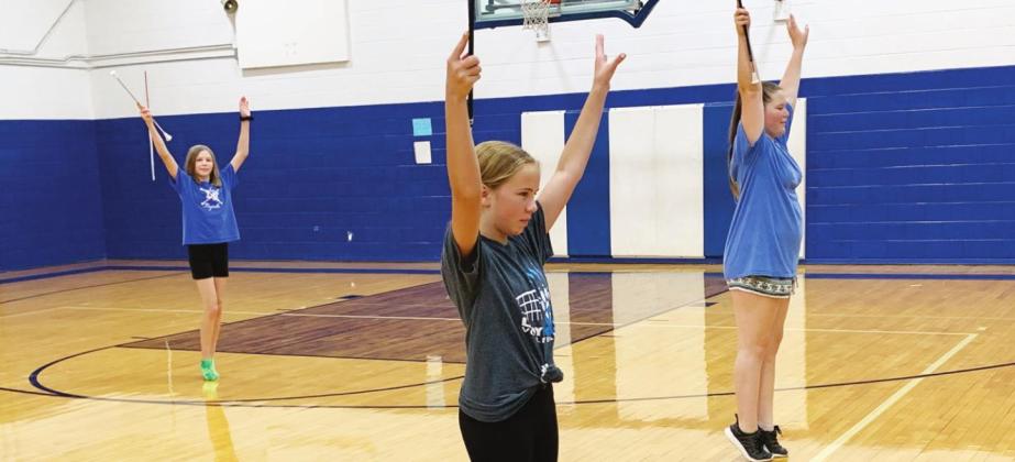 Maggee Winters, Hannah Snow and Kendall Baker worked on their majorette routine last week. L-K junior high majorettes prepare for new year