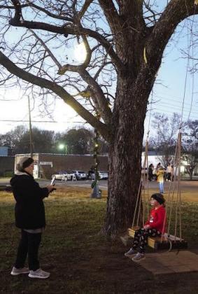 The swing a tree in downtown Atlanta is lately the most photographed location. Notice the big, flashy lights on the tree itself. Hometown Christmas