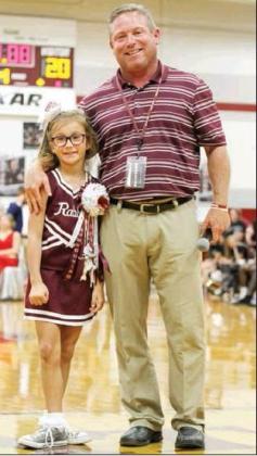 Photo by KENISHA WEBSTER Atlanta Head Coach Matt McClure stands with 12th Man winner Annison Hale. Article Image Alt Text