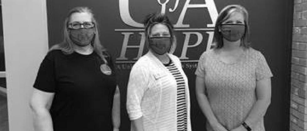 Pictured left to right: Cindy Lance, Vice Chancellor for Finance and Administration; Marla Matthews, Executive Assistant to the Chancellor; Laura Clark, Vice Chancellor for Academics. U of A Hope-Texarkana employees return to campus
