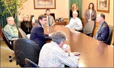 Pittsburg Gazette photo/ELLIS KNOX U.S. Rep. John Ratcliffe, R-Texas, visits with the board of directors of Cypress Bank in Pittsburg as part of his Northeast Texas Tax Cut Roadshow in April 2018. Article Image Alt Text