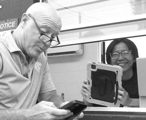 On the visitor’s side of Queen City Bulldog Stadium is this one ticket booth being manned by Ivy Wong. The gentleman on the left is from the Grace Community School. On the visitor’s side of Queen City Bulldog Stadium is this one ticket booth being manned by Ivy Wong. The gentleman on the left is from the Grace Community School.
