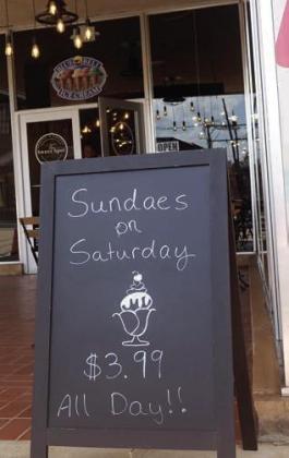 Here is a pleasant invitation as well as a good use of language. It’s to attract the customer to The Sweet Shop.Sundaes on Saturdays. Someone is a good chalkboard artist, too. Around Atlanta