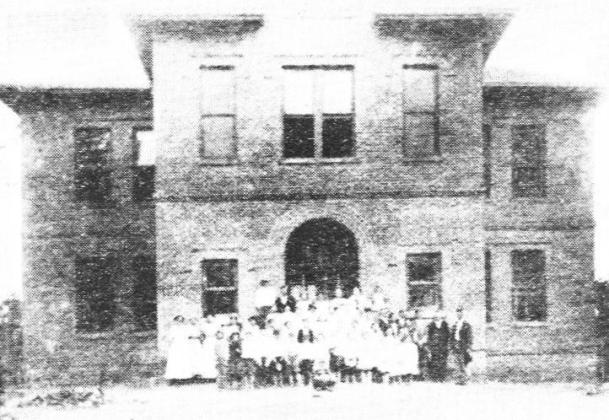 The entire student body of the Avinger School in 1913 is pictured above, at the end of the first year’s occupancy of the new building. Cass County