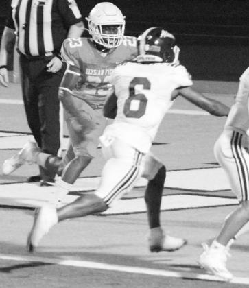 Jamarion Austin battles his way into the endzone for a touchdown.The Rabbs crushed Elysian Fields 51-6 in the season opener. Photo by SAMANTHA WILBANKS Atlanta Rabbits defeat Elysian Fields, 51-6