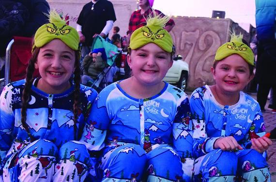 We think these three elves have escaped Santa’s North Pole and have shown up waiting for the parade.They are, from left, Whitlee Price, and Abby and Elizabeth Lewallen. Faces of Cass County