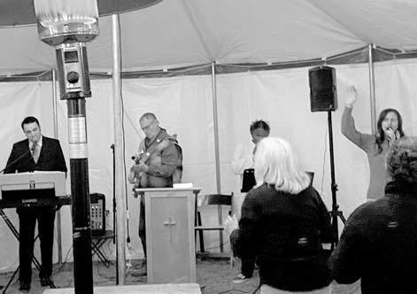 From left: Shelby Crump, Vic Helton, Maya Richardson and Starla Hill lead worship service at a tent service in Queen City. Crump, an Atlanta,Texas native along with his wife Amy, two sons and the rest of their crew will be traveling the states to bring te Mission America