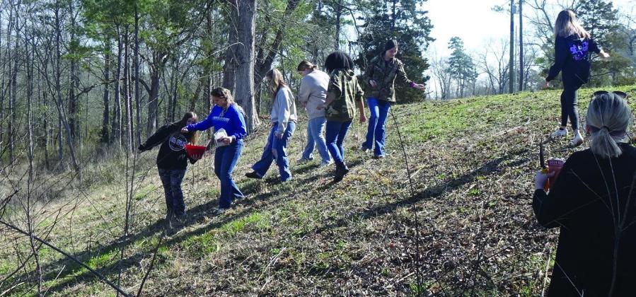 These Linden-Kildare High School students are having fun getting wild flower seeds to throw.The wild flowers will highlight the planned brick-making memorial site. Linden City Park
