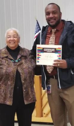Mildred Harris presents Colby Boyce and Clifton Dickerson with certificates of appreciation at Eastern Cass County Retirees Association in celebration of Black History Month. Article Image Alt Text
