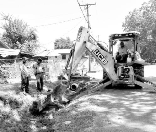 A Photo submitted by Raydeen Edwards, Special to the Journal City workers install culvert