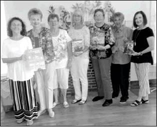 Pictured left to right are Luci Trahan, Merle Duncan, Nancy Belford, Sue Lazara, Kay Stephens, Jo Miller, and Tammie Blackburn. Article Image Alt Text