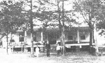 The Old Avinger Homestead of Dr. H.J.Avinger in 1860, later remodeled, is shown above. In the picture, taken in 1913, are left to right, Elise, John and Joe Dan Avinger. Cass County