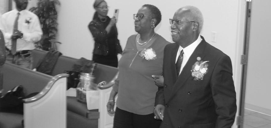 Reverend Arlistel Maxie, pastor of Shiloh Missionary Baptist Church, is escorted into the sanctuary at Enon First Missionary Baptist Church by his daughter Amanda Maxie. Reverend Maxie and his wife were honored by those present for his 15th Anniversary Se James Thomas Morgan, Part 2