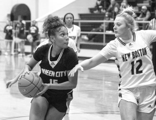 The New Boston Lions went head-to-head with the Queen City Bulldogs last Friday with the Lions falling by a score of 58-41.The Lady Lions won their varsity contest by a final score of 48-41. In the ABOVE PHOTO: QC’s Dori Sasser has her eyes on the hoop The New Boston Lions went head-to-head with the Queen City Bulldogs last Friday with the Lions falling by a score of 58-41.The Lady Lions won their varsity contest by a final score of 48-41. In the ABOVE PHOTO: QC’s Dori Sasser has her eyes on the hoop