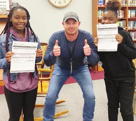 Twin sisters Lakia Parker and Lamia Parker passed the Microsoft Office Specialist - Word 2016 Exam recently. The sisters became the first set of twins to do so. The twins are pictured here with educator Nick Miller. Article Image Alt Text