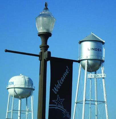 Overhead in Linden, period streetlamps and banners are well-cared for. Their purpose is to make the public feel at home. Overhead in Linden, period streetlamps and banners are well-cared for. Their purpose is to make the public feel at home.