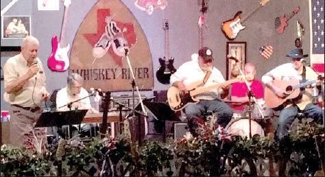Mike Helms, owner of the Maytag Opry, sings with his band, Friday August 2. Article Image Alt Text