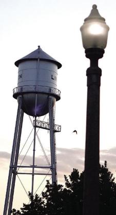The frosted 1934 street lamp is shown with Linden’s historical 1934 water tower. Both could be considered to give the town a long-life and respected impression. The lights of the courthouse
