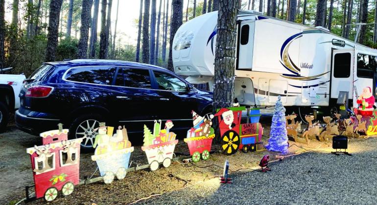 Santa and his right hand man Ruldoloh practice leading the yearly team of reindeer for their long flight around the world next weekend. Atlanta State Park Holiday Lights