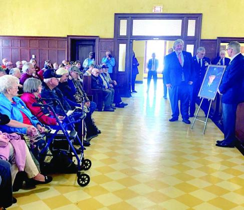 A portrait of the late Staff Sgt. John O’Neal Rucker by artist Colin Kimball is unveiled before family and fellow veterans at Historic Cass County Courthouse in Linden,Texas. Vietnam War Veterans honored