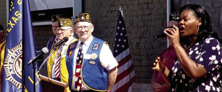 The late Stephanie Casteel, musician and teacher, adds her voice in song to the Memorial Day observance.With her are,from left,Raymond Herrington and Dean Hopper. MEMORIAL DAY