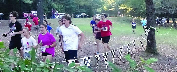 This picture shows a park,cars,runners,a well-marked trail and some of the 60 athletes taking part in a medical benefit Saturday at the Atlanta Sportsplex Park. This picture shows a park,cars,runners,a well-marked trail and some of the 60 athletes taking part in a medical benefit Saturday at the Atlanta Sportsplex Park.