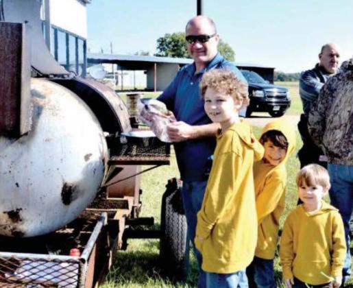 Atlanta Police Chief Robin Betts grills the hamburgers with help from his grandsons. Atlanta Airport hosts Fall Fly-In