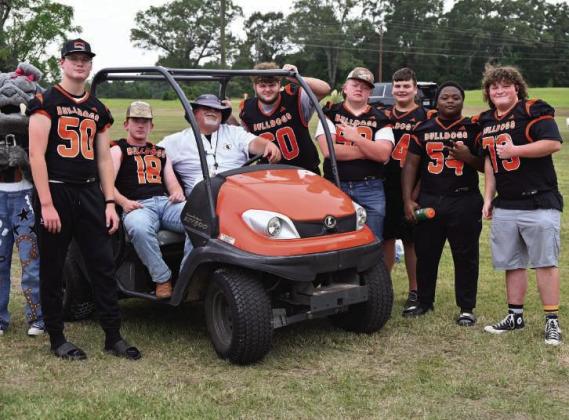 Queen City AD Coach Wilbanks and a handful of football players prepare for the Homecoming parade. Queen City AD Coach Wilbanks and a handful of football players prepare for the Homecoming parade.