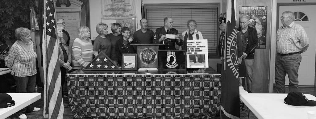 Outreach Committee presents check
