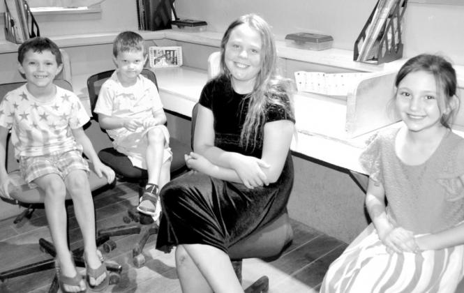 Zeke Hill, Eli Hill, Holly Lowery and Raenee Hill are all eager for the school year to begin at Lowery Christian Academy. Photo by Kate Stow Article Image Alt Text