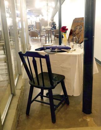 The chair is empty but the table is full. And the people here will remember. The setting is at the Sweet Spot sweetshop in Atlanta. The day is Feb. 28, 1991, which for owner and Marine Tim Collins was the day his fellow soldier was KIA. The Emply Chair
