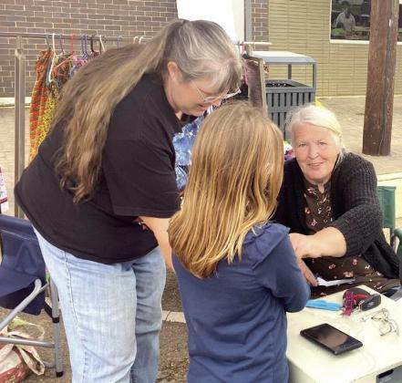 ChristineTrusty,with help from her daughter Belinda, makes free bracelets for the kiddos. The mother and daughter team sold an eclectic array of handmade tablecloths potholders,cross-stitching, home decor and more. LINDEN LOCALE: Spring Fling kickoff