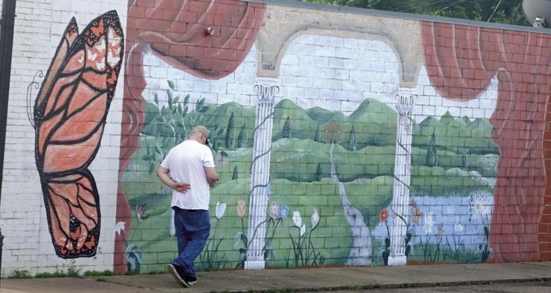 A little off the main street in Hughes Springs, but this wall of a building is used to display a comforting scene. The butterfly, green hills and lake are features of life here. Around 1st Street in Hughes Springs