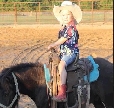 Texi Belle Hodges, on her horse Hoss, is the 2-year old daughter of Caleb and Megan Hodges. Article Image Alt Text