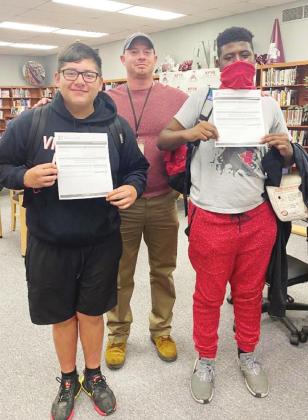 Alan Morales and Anthony Hamilton both passed the Microsoft Office Specialist - Word 2016 Exam recently and is ictured with teacher Nick Miller. Article Image Alt Text