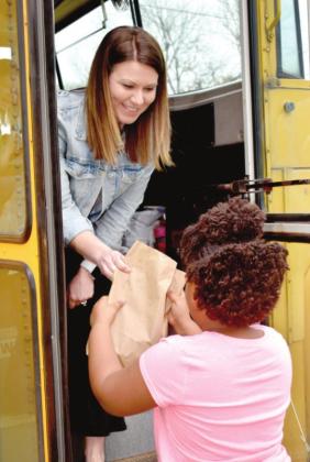 Queen City ISD sends meals, curriculum to students via bus convoy