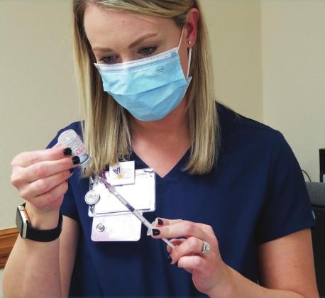 Nurse Kelsie of Atlanta Memorial Hospital, CHRISTUS Health, prepares for her next recipients of the COVID-19 vaccine. Photo by Lacy Gross Atlanta hospital receives COVID-19 vaccine, heralds ‘beginning of the end’
